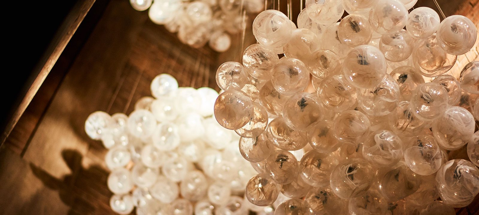 Clusters of cream-colored glass bubbles on the ceiling at our Detroit hotel