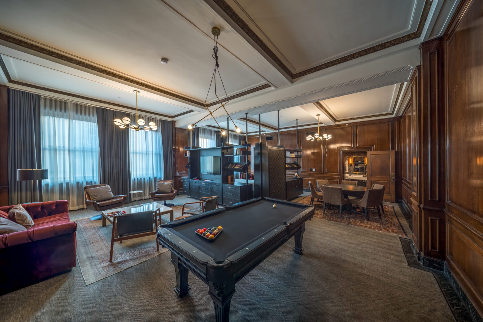 Spacious hotel suite in downtown Detroit featuring a pool table