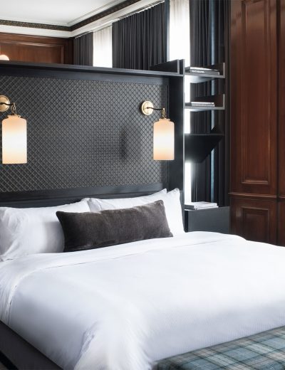 Sconces over a hotel bed at our Detroit luxury hotel