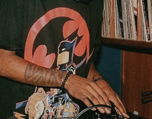 DJ wearing a Batman t-shirt at our boutique downtown hotel in Detroit