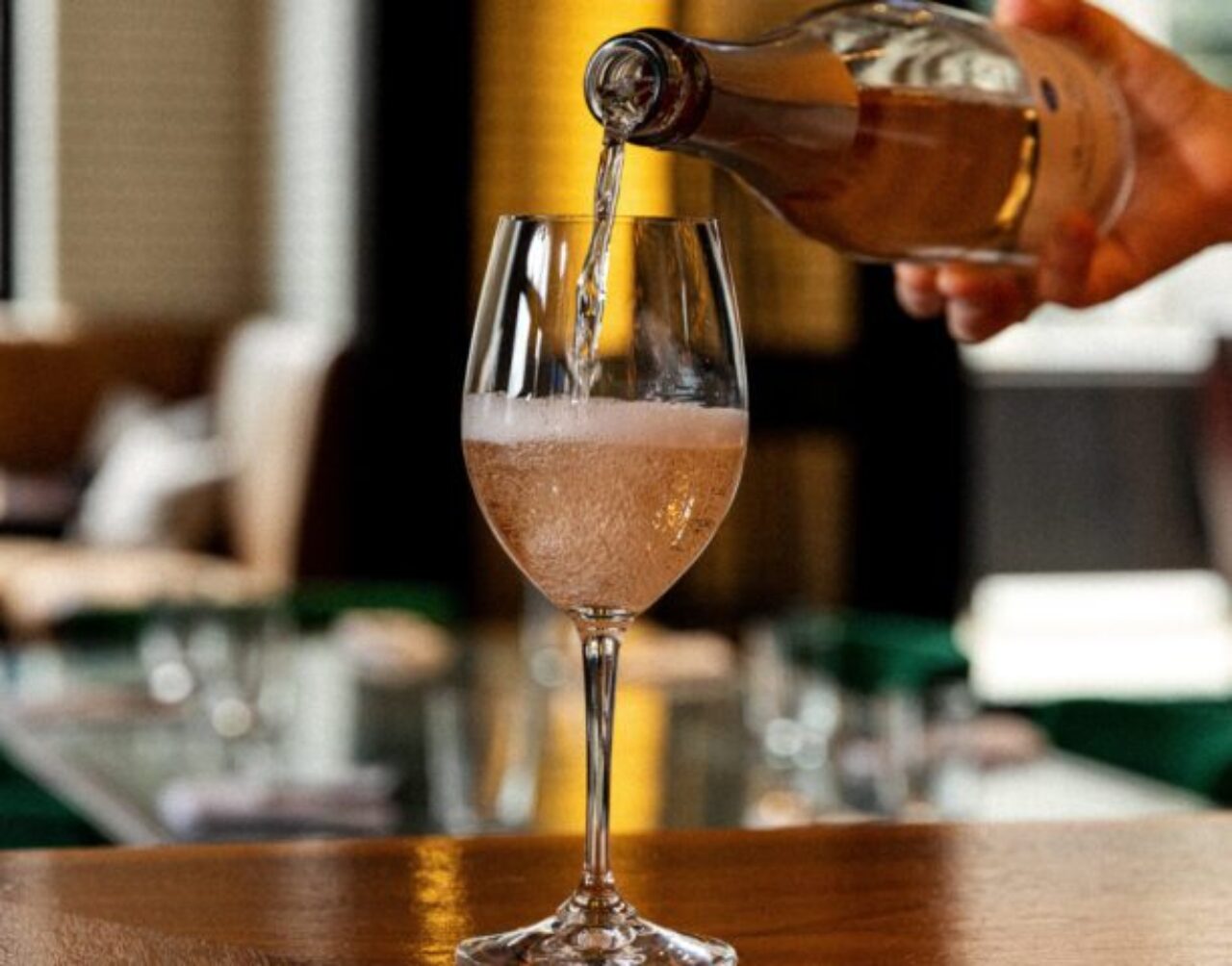 Wine being poured into a glass