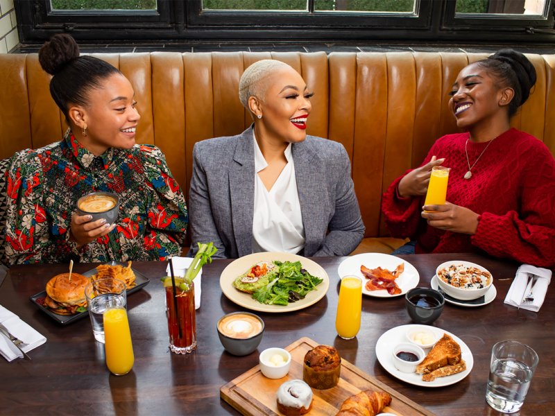 Women sitting around a table with food