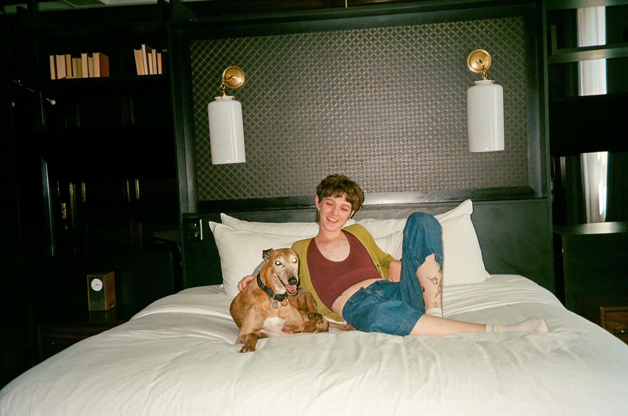 woman and dog on bed
