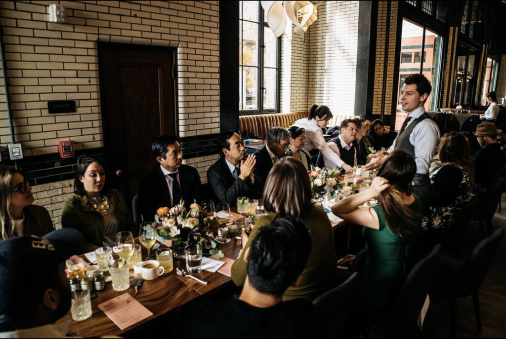 A group of wedding guests sat at a table together